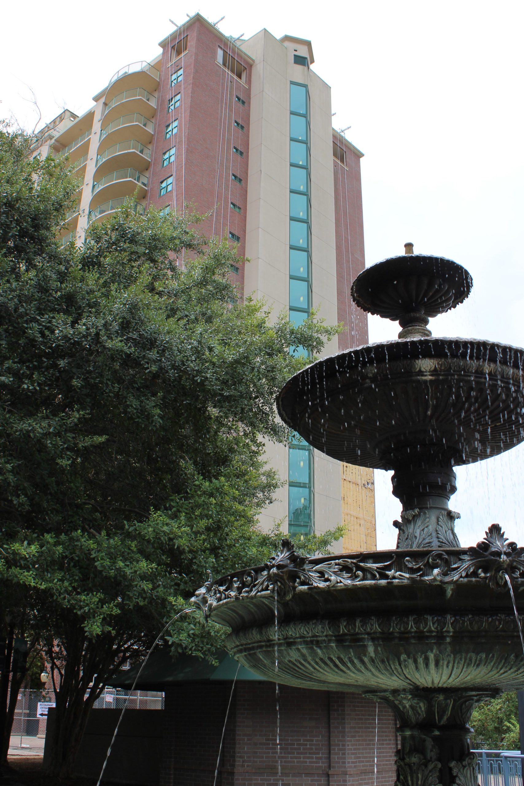 Photo of Plaza Towers and the plaza fountain. Plaza Tower has many condos available in Tallahassee