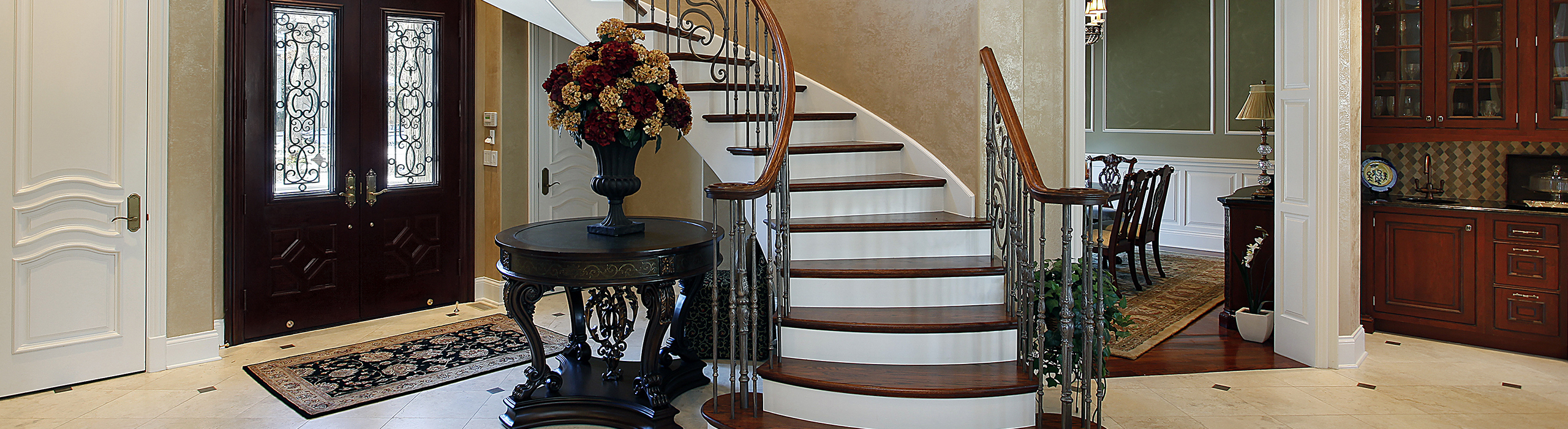 Decorative photo of a fancy balustrade in a grand opening in what looks like a luxury home. Pricing a home correctly is the best way to get the most money from your house sale.